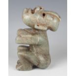 A pre-Columbian Olmec style carved green hardstone double-position figure, probably 900-450 BC,