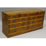A late 20th century yew and brass bound campaign style chest of twelve drawers, height 71cm, width