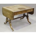 A Regency mahogany sofa table, the reeded edge top above two opposing drawers and dummy drawers,