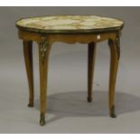 A late 19th/early 20th century French walnut shaped oval occasional table with gilt metal mounts,