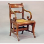 A Regency mahogany bar back metamorphic library armchair, possibly by Gillows of Lancaster,