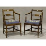 A pair of George IV mahogany elbow chairs with boxwood stringing and drop-in seats, height 85cm,