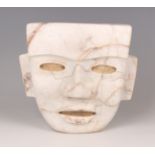 A substantial pre-Columbian Teotihuacan style carved cream hardstone mask, probably 250-700 AD, with