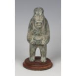 A pre-Columbian Olmec style carved green hardstone starcatcher figure, probably 900-450 BC,