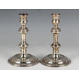 A pair of Elizabeth II silver knop stem candlesticks, each with a reeded circular base, London