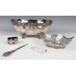 A pair of George V silver sugar tongs, Birmingham 1927, and a silver handled buttonhook, Chester