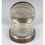 An Edwardian silver cased desk barometer, the silvered dial with mercury thermometer, the