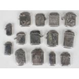 A group of fourteen silver vesta cases, the majority with engraved decoration, including one with