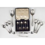 A set of six George V silver coffee spoons, London 1918, cased, and a small collection of silver