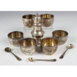 A set of six Victorian silver circular salts, each engraved with foliate stems, together with