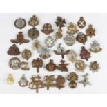 A collection of military cap badges, mostly British Army but including some foreign, may include