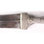 A mid-20th century Middle Eastern silver mounted jambia with typical curved blade with central
