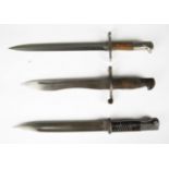 A collection of seven mid-20th century Continental and world bayonets, including a Spanish M1941