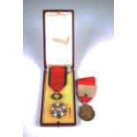 A Lebanon Order of The Cedar, with a French case, and a Lebanon Medal of Merit.Buyer’s Premium 29.4%