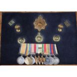 A group of nine First and Second World War period medals and related Royal Marines badges to G.