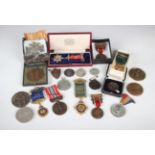 A collection of medals and medallions, including a silver star shaped Council Master's Chapter