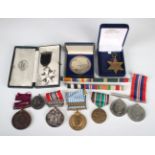 A collection of medals and further awards, comprising an Atlantic Star, two 1939-45 War Medals,