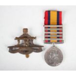 A Queen's South Africa Medal with five bars, 'Tugela Heights', 'Orange Free State', 'Relief of