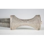 A late 19th century Middle Eastern silver mounted jambia with curved blade, blade length 19cm, and