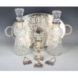 A near pair of Elizabeth II silver mounted thistle shaped cut glass decanters and stoppers,