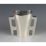 An Edwardian Irish silver two-handled vase, the tapered body flanked by a pair of angular upright