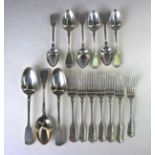A George IV and later harlequin part canteen of silver Fiddle pattern cutlery, comprising three