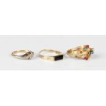 A Middle Eastern gold and varicoloured gem set five shank ring, weight 2.1g, (two gems lacking), a