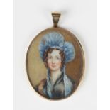 A gold mounted oval pendant locket frame, one side glazed with a painted portrait miniature of a