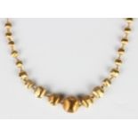 An Italian Marco Bicego gold Africa collection necklace, formed as a row of graduated textured beads