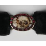 A moss agate and foil backed garnet set oval clasp, probably Continental, circa 1800, the oval