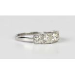 A platinum and diamond five stone ring, mounted with a row of graduated circular cut diamonds,