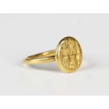 A gold intaglio ring, probably Byzantine, circa 1000-1400 AD, the oval bezel seal engraved with a