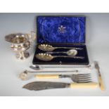 A late Victorian plated three-piece fruit set, comprising a pair of berry spoons and a sugar sifter,