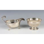 A late Victorian silver circular reeded sugar bowl on a flared circular foot, Sheffield 1899 by