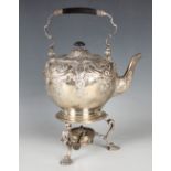 A late Victorian silver spirit kettle and heater stand, the globular body embossed with flowers