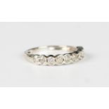 An 18ct white gold and diamond ten stone half-hoop eternity ring, mounted with a row of circular cut