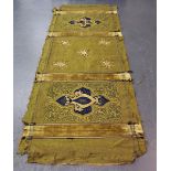 An early 20th century ecclesiastical woven green fabric and gilt thread embroidered alter cloth,