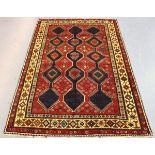 A Lori rug, North-west Persia, mid/late 20th century, the red field with three columns of linked