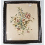 A George III silkwork panel, finely worked with a floral bouquet, 36cm x 31cm, within a period