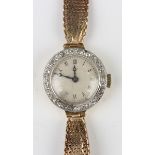 An 18ct gold and later diamond set circular cased lady's wristwatch, the unsigned jewelled lever