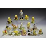 Sixteen Royal Doulton Winnie The Pooh collection figures, including Christopher Robin, Eeyore's
