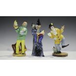 Three Royal Doulton figures, comprising Punch and Judy Man, HN2765, The Clown, HN2890, and The