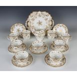 A Ridgway porcelain gilt decorated part service, mid-19th century, with flower sprays flanked by