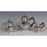 A late 19th century French silver three-piece bachelor's tea set of spiral reeded form with