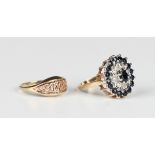 A 9ct gold, sapphire and diamond oval cluster ring, claw set with the principal oval cut sapphire at