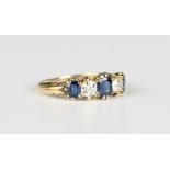 A gold, sapphire and diamond five stone ring, mounted with three cushion cut sapphires alternating