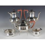 An Elizabeth II silver five-piece tea and coffee set of cushion form with gadrooned rim, on bun