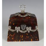 A late Victorian silver mounted tortoiseshell tea caddy of tapering rectangular form, the hinged lid