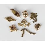 Four 9ct gold charms, comprising a boat, a bunch of four keys, Faith, Hope and Charity and a