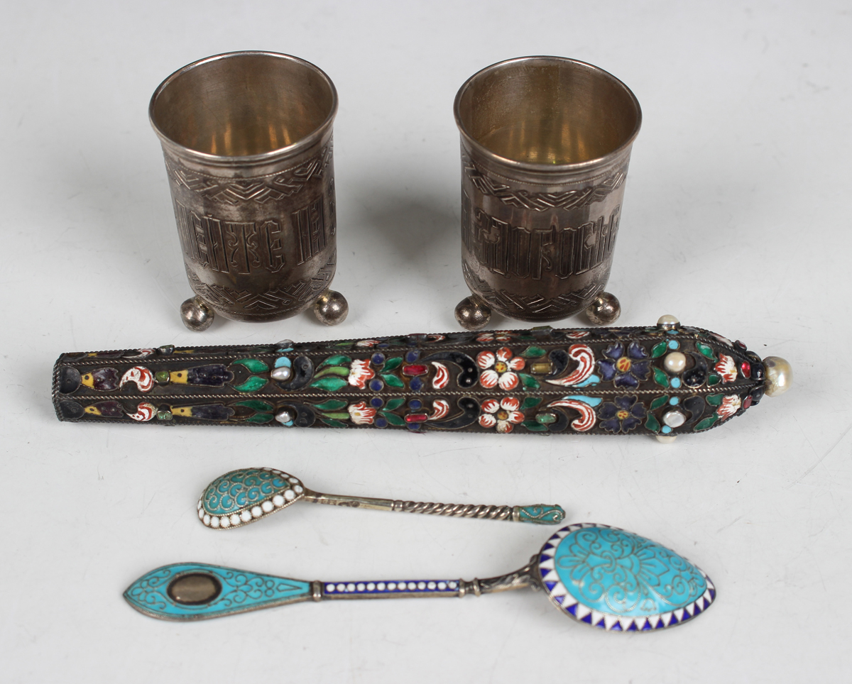 A pair of Russian silver beakers, 84 zolotnik, each of cylindrical form, decorated with Cyrillic